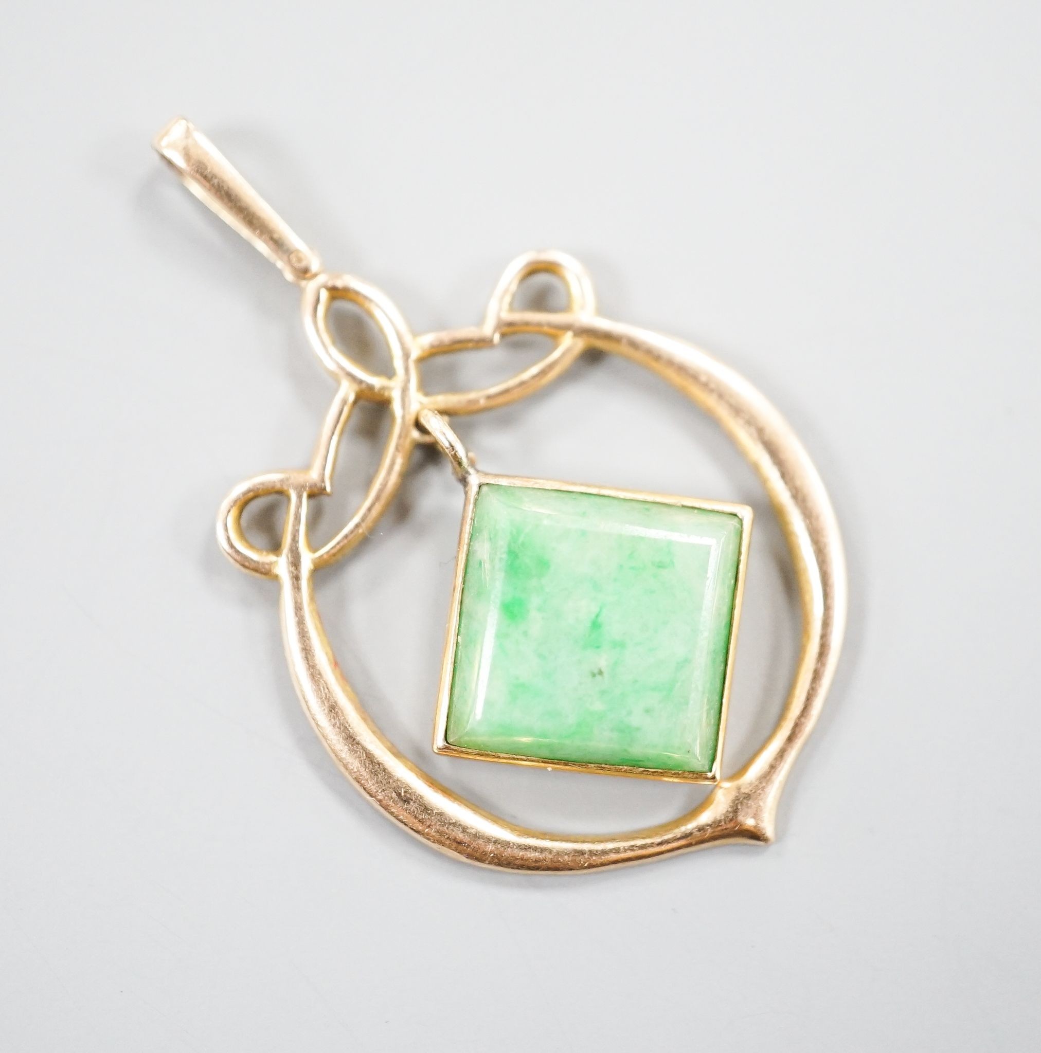 A yellow metal mounted jade pendant, overall 35mm, gross 2.6 grams.